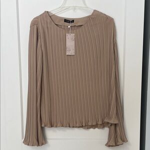 Women’s size large pleated blouse.
